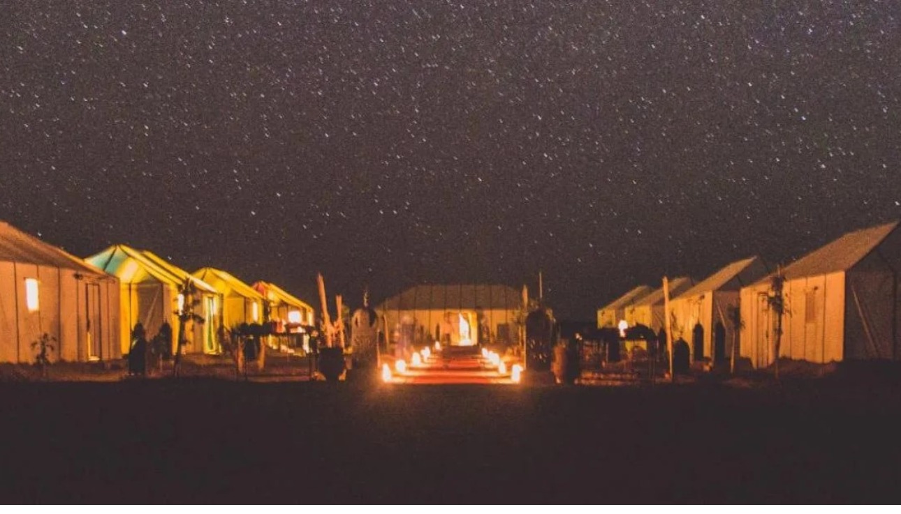 Romantic desert camp in Morocco under a starry night sky - perfect for couples getway