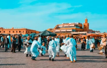 Tourists and locals enjoying a peaceful atmosphere in Jeamaa El Fna square, Marrakech