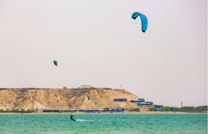 Kitesurfers riding the waves in the Dakhla Lagoon , Western Sahara , Morocco