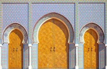 Golden gates of the Royal Palace in Fes , Morocco with traditional Moroccan mosaic acrchtecture